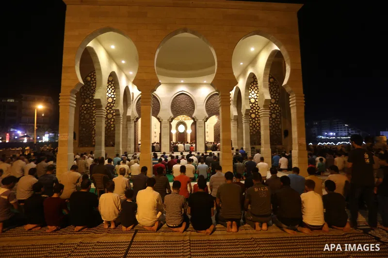 Palestinian Muslim worshippers pray overnight on July 22, 2017 at a Mosque in Gaza city on the occasion of Laylat al-Qadr which falls on the 27th day of the fasting month of Ramadan. Laylat al-Qadr, or Night of Destiny,...