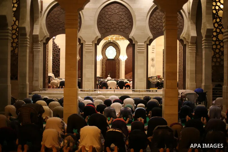 Palestinian Muslim worshippers pray overnight on July 22, 2017 at a Mosque in Gaza city on the occasion of Laylat al-Qadr which falls on the 27th day of the fasting month of Ramadan. Laylat al-Qadr, or Night of Destiny,...