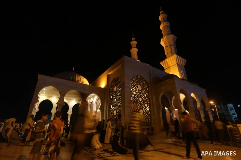Palestinian Muslim worshippers pray overnight on July 22, 2017 at a Mosque in Gaza city on the occasion of Laylat al-Qadr which falls on the 27th day of the fasting month of Ramadan. Laylat al-Qadr, or Night of Destiny,...