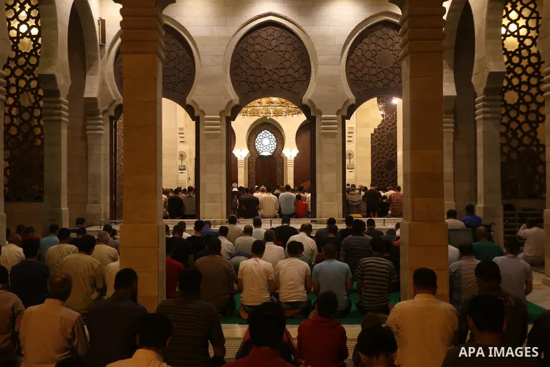 Palestinian Muslim worshippers pray overnight on July 22, 2017 at a Mosque in Gaza city on the occasion of Laylat al-Qadr which falls on the 27th day of the fasting month of Ramadan. Laylat al-Qadr, or Night of Destiny,...