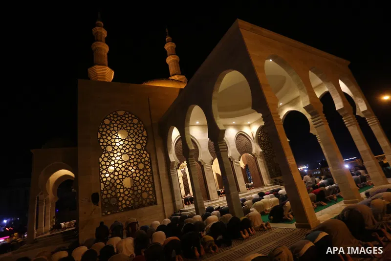 Palestinian Muslim worshippers pray overnight on July 22, 2017 at a Mosque in Gaza city on the occasion of Laylat al-Qadr which falls on the 27th day of the fasting month of Ramadan. Laylat al-Qadr, or Night of Destiny,...