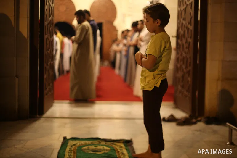 Palestinian Muslim worshippers pray overnight on July 22, 2017 at a Mosque in Gaza city on the occasion of Laylat al-Qadr which falls on the 27th day of the fasting month of Ramadan. Laylat al-Qadr, or Night of Destiny,...
