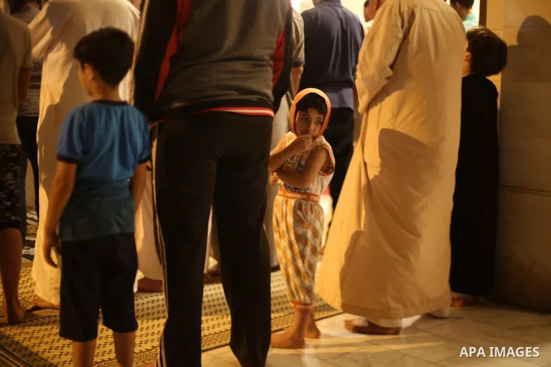 Palestinian Muslim worshippers pray overnight on July 22, 2017 at a Mosque in Gaza city on the occasion of Laylat al-Qadr which falls on the 27th day of the fasting month of Ramadan. Laylat al-Qadr, or Night of Destiny,...