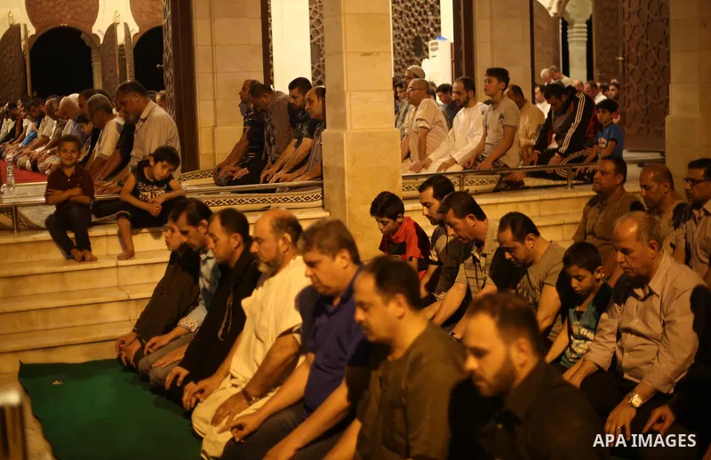 Palestinian Muslim worshippers pray overnight on July 22, 2017 at a Mosque in Gaza city on the occasion of Laylat al-Qadr which falls on the 27th day of the fasting month of Ramadan. Laylat al-Qadr, or Night of Destiny,...