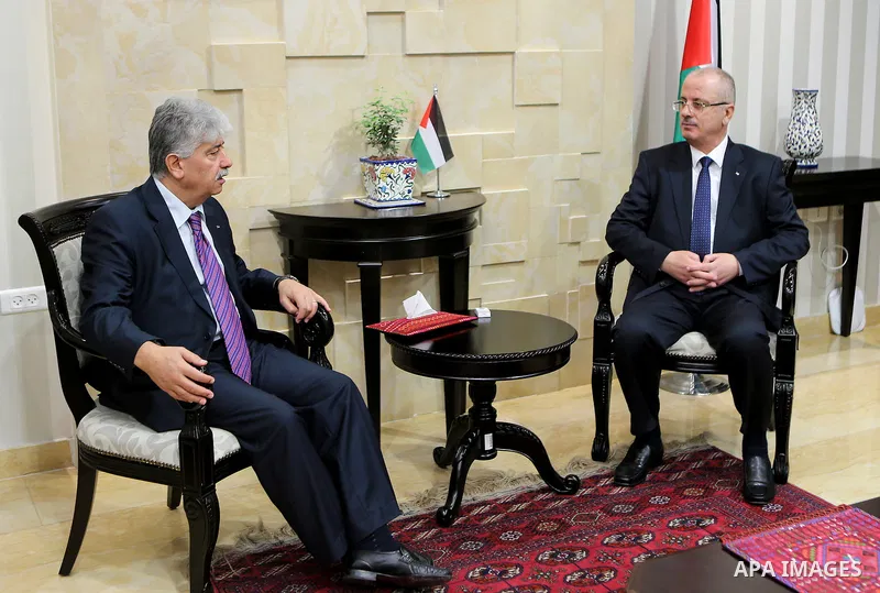Palestinian Prime Minister Rami Hamdallah receives report of the Palestinian retirement Authority for 2016, at his office in the West Bank city of Ramallah on June 22, 2017. Photo by Prime Minister Office