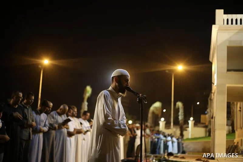 Palestinian Muslim worshippers pray overnight on July 22, 2017 at a Mosque in Gaza city on the occasion of Laylat al-Qadr which falls on the 27th day of the fasting month of Ramadan. Laylat al-Qadr, or Night of Destiny,...