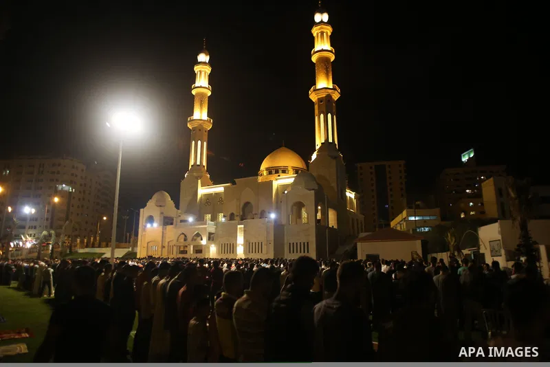 Palestinian Muslim worshippers pray overnight on July 22, 2017 at a Mosque in Gaza city on the occasion of Laylat al-Qadr which falls on the 27th day of the fasting month of Ramadan. Laylat al-Qadr, or Night of Destiny,...