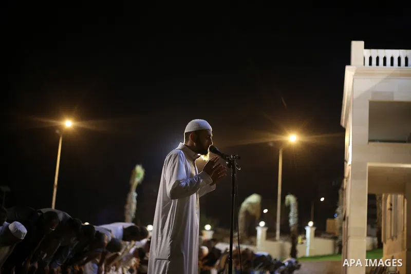 Palestinian Muslim worshippers pray overnight on July 22, 2017 at a Mosque in Gaza city on the occasion of Laylat al-Qadr which falls on the 27th day of the fasting month of Ramadan. Laylat al-Qadr, or Night of Destiny,...