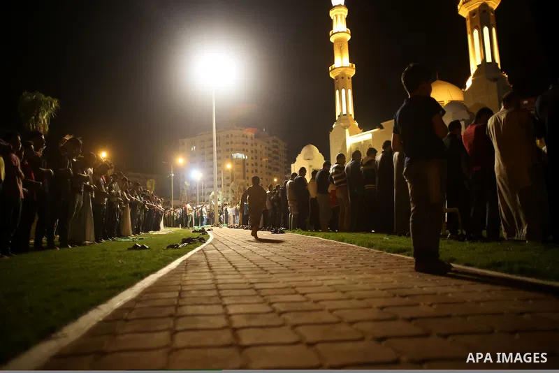 Palestinian Muslim worshippers pray overnight on July 22, 2017 at a Mosque in Gaza city on the occasion of Laylat al-Qadr which falls on the 27th day of the fasting month of Ramadan. Laylat al-Qadr, or Night of Destiny,...