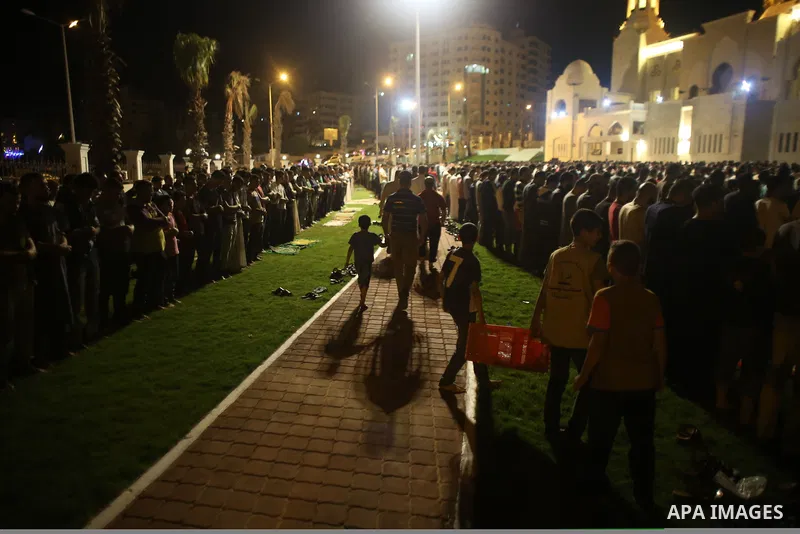 Palestinian Muslim worshippers pray overnight on July 22, 2017 at a Mosque in Gaza city on the occasion of Laylat al-Qadr which falls on the 27th day of the fasting month of Ramadan. Laylat al-Qadr, or Night of Destiny,...