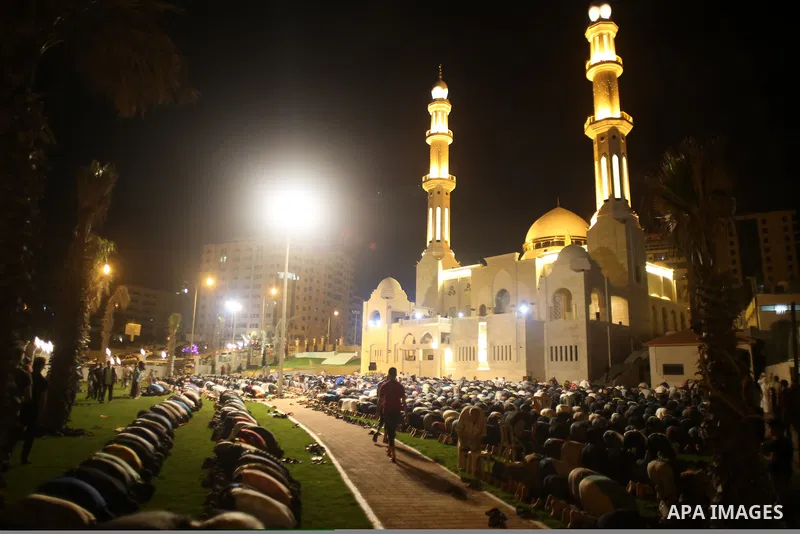 Palestinian Muslim worshippers pray overnight on July 22, 2017 at a Mosque in Gaza city on the occasion of Laylat al-Qadr which falls on the 27th day of the fasting month of Ramadan. Laylat al-Qadr, or Night of Destiny,...