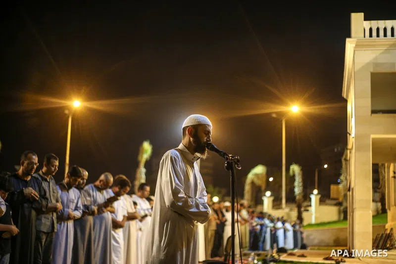 Palestinian Muslim worshippers pray overnight on July 22, 2017 at a Mosque in Gaza city on the occasion of Laylat al-Qadr which falls on the 27th day of the fasting month of Ramadan. Laylat al-Qadr, or Night of Destiny,...