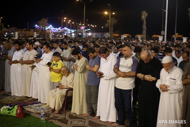 Palestinian Muslim worshippers pray overnight on July 22, 2017 at a Mosque in Gaza city on the occasion of Laylat al-Qadr which falls on the 27th day of the fasting month of Ramadan. Laylat al-Qadr, or Night of Destiny,...