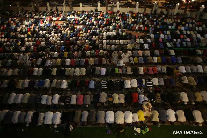 Palestinian Muslim worshippers pray overnight on July 22, 2017 at a Mosque in Gaza city on the occasion of Laylat al-Qadr which falls on the 27th day of the fasting month of Ramadan. Laylat al-Qadr, or Night of Destiny,...