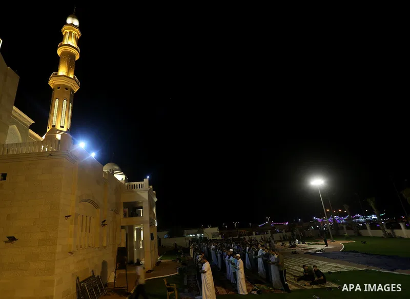 Palestinian Muslim worshippers pray overnight on July 22, 2017 at a Mosque in Gaza city on the occasion of Laylat al-Qadr which falls on the 27th day of the fasting month of Ramadan. Laylat al-Qadr, or Night of Destiny,...