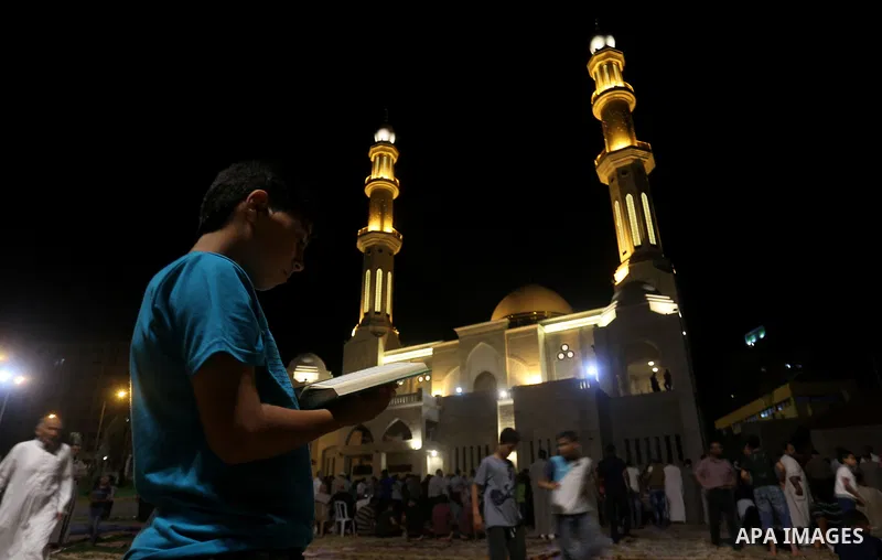 Palestinian Muslim worshippers pray overnight on July 22, 2017 at a Mosque in Gaza city on the occasion of Laylat al-Qadr which falls on the 27th day of the fasting month of Ramadan. Laylat al-Qadr, or Night of Destiny,...