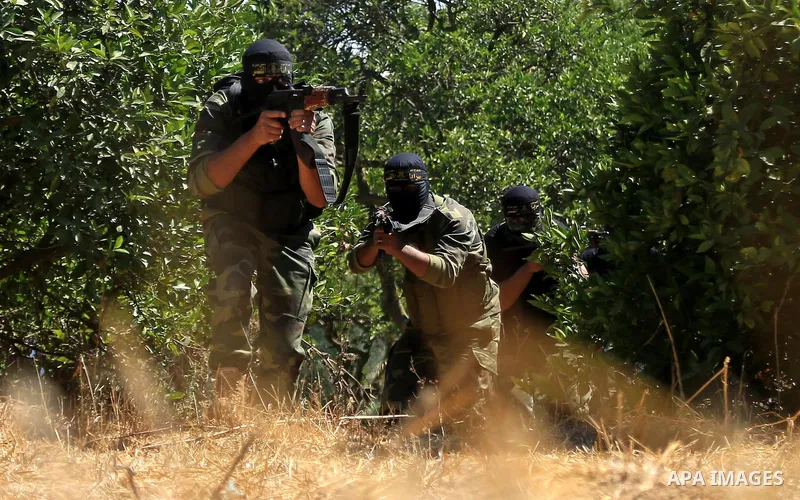 Palestinian militants from the Al-Quds Brigades, the armed wing of the Islamic Jihad movement guard the border in the east of Gaza city on the Muslim holy fasting month of Ramadan on June 22, 2017. Ramadan is sacred to M...