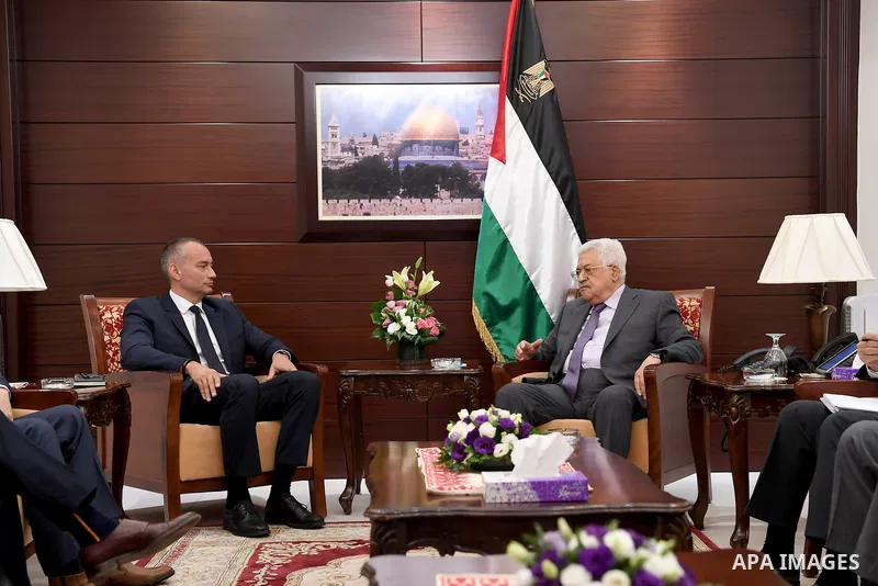 Palestinian President Mahmoud Abbas receives the annual report of the Retirement Authority, in the West Bank city of Ramallah, on June 22, 2017. Photo by Osama Falah