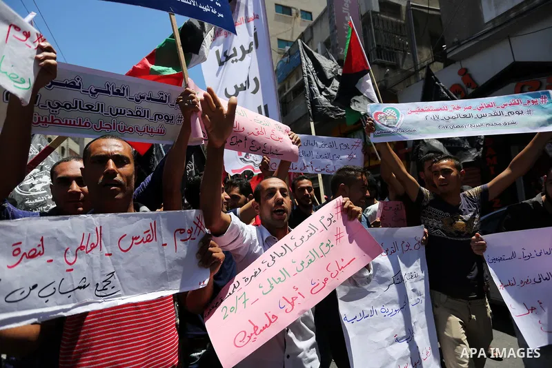 Palestinians take part in a protest marking the annual al-Quds Day, or Jerusalem Day, following Friday prayer in Gaza city June 23, 2017. Photo by Ashraf Amra