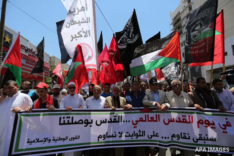 Palestinians take part in a protest marking the annual al-Quds Day, or Jerusalem Day, following Friday prayer in Gaza city June 23, 2017. Photo by Ashraf Amra