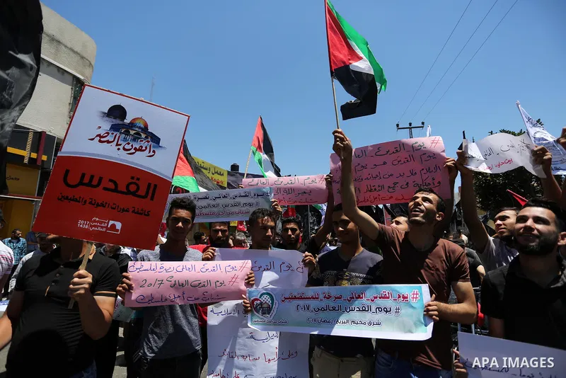 Palestinians take part in a protest marking the annual al-Quds Day, or Jerusalem Day, following Friday prayer in Gaza city June 23, 2017. Photo by Ashraf Amra