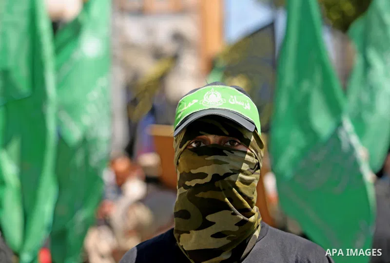 A masked Palestinian youth takes part in a protest marking the annual al-Quds Day, or Jerusalem Day, following Friday prayer in Gaza city June 23, 2017. Photo by Ashraf Amra