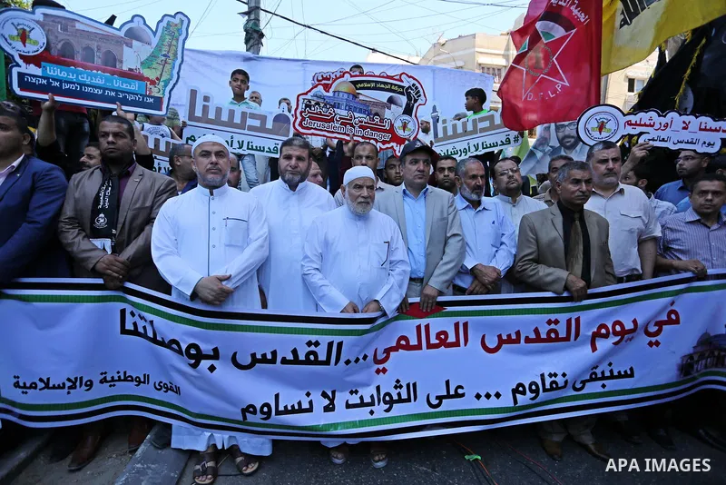 Palestinians take part in a protest marking the annual al-Quds Day, or Jerusalem Day, following Friday prayer in Gaza city June 23, 2017. Photo by Ashraf Amra