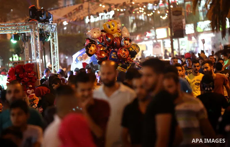 Palestinians shop at a market a few days ahead of Eid al-Fitr holiday, in the West Bank city of Nablus on June 23, 2017. Eid al-Fitr marks the end of Muslim's holy fasting month of Ramadan when faithfuls abstain from eat...