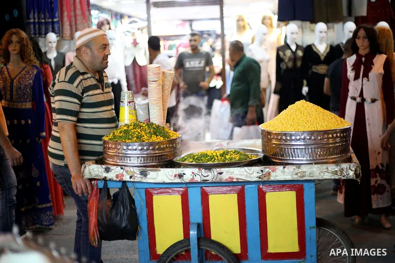 Palestinians shop at a market a few days ahead of Eid al-Fitr holiday, in the West Bank city of Nablus on June 23, 2017. Eid al-Fitr marks the end of Muslim's holy fasting month of Ramadan when faithfuls abstain from eat...