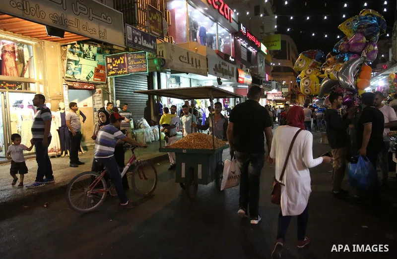 Palestinians shop at a market a few days ahead of Eid al-Fitr holiday, in the West Bank city of Nablus on June 23, 2017. Eid al-Fitr marks the end of Muslim's holy fasting month of Ramadan when faithfuls abstain from eat...