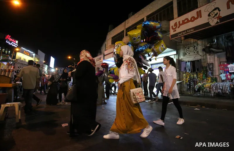 Palestinians shop at a market a few days ahead of Eid al-Fitr holiday, in the West Bank city of Nablus on June 23, 2017. Eid al-Fitr marks the end of Muslim's holy fasting month of Ramadan when faithfuls abstain from eat...