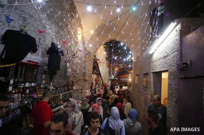 Palestinians shop at a market a few days ahead of Eid al-Fitr holiday, in the West Bank city of Nablus on June 23, 2017. Eid al-Fitr marks the end of Muslim's holy fasting month of Ramadan when faithfuls abstain from eat...