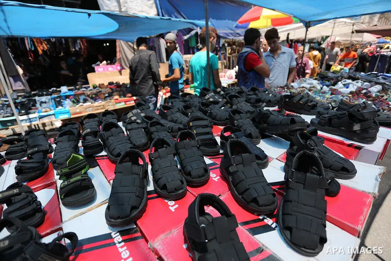 Palestinians shop at a market ahead of Eid al-Fitr holiday, in Gaza city on June 24, 2017. Eid al-Fitr marks the end of Muslim's holy fasting month of Ramadan when faithfuls abstain from eating, drinking, smoking and sex...