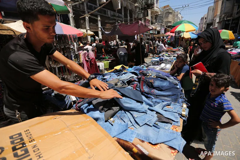 Palestinians shop at a market ahead of Eid al-Fitr holiday, in Gaza city on June 24, 2017. Eid al-Fitr marks the end of Muslim's holy fasting month of Ramadan when faithfuls abstain from eating, drinking, smoking and sex...