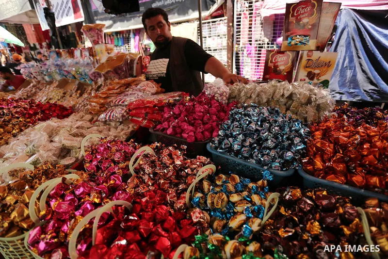 A Palestinian vendor sells chocolate at a market ahead of Eid al-Fitr holiday, in Gaza city on June 24, 2017. Eid al-Fitr marks the end of Muslim's holy fasting month of Ramadan when faithfuls abstain from eating, drinki...