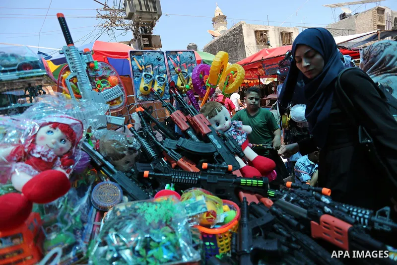 Palestinians shop at a market ahead of Eid al-Fitr holiday, in Gaza city on June 24, 2017. Eid al-Fitr marks the end of Muslim's holy fasting month of Ramadan when faithfuls abstain from eating, drinking, smoking and sex...