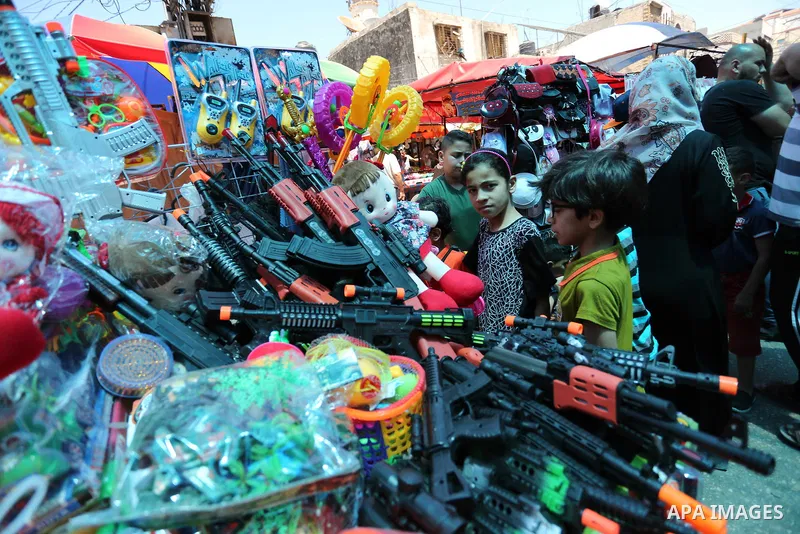 Palestinians shop at a market ahead of Eid al-Fitr holiday, in Gaza city on June 24, 2017. Eid al-Fitr marks the end of Muslim's holy fasting month of Ramadan when faithfuls abstain from eating, drinking, smoking and sex...