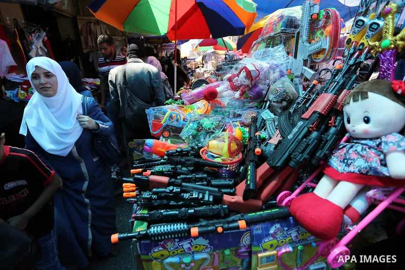 Palestinians shop at a market ahead of Eid al-Fitr holiday, in Gaza city on June 24, 2017. Eid al-Fitr marks the end of Muslim's holy fasting month of Ramadan when faithfuls abstain from eating, drinking, smoking and sex...
