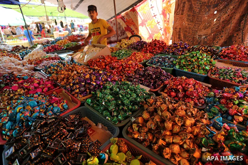 A Palestinian vendor sells chocolate at a market ahead of Eid al-Fitr holiday, in Gaza city on June 24, 2017. Eid al-Fitr marks the end of Muslim's holy fasting month of Ramadan when faithfuls abstain from eating, drinki...