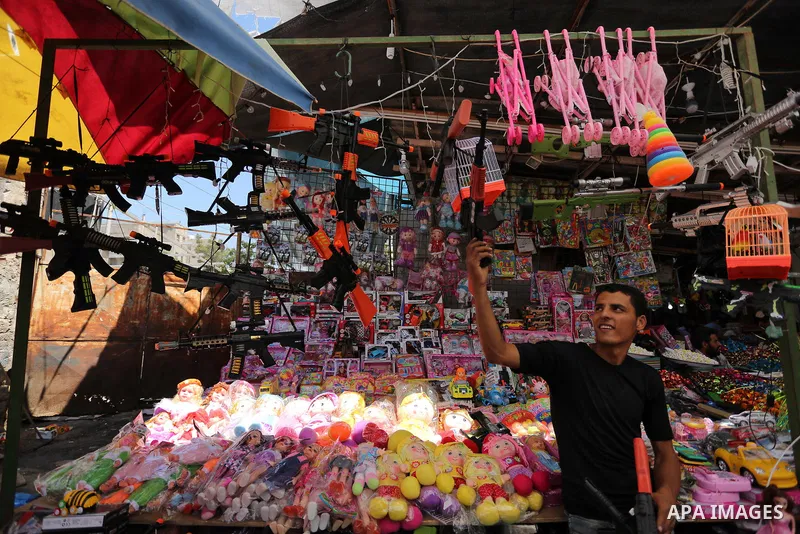 Palestinians shop at a market ahead of Eid al-Fitr holiday, in Gaza city on June 24, 2017. Eid al-Fitr marks the end of Muslim's holy fasting month of Ramadan when faithfuls abstain from eating, drinking, smoking and sex...