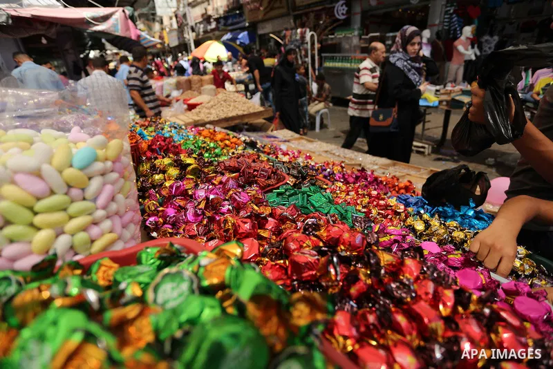 A Palestinian vendor sells chocolate at a market ahead of Eid al-Fitr holiday, in Gaza city on June 24, 2017. Eid al-Fitr marks the end of Muslim's holy fasting month of Ramadan when faithfuls abstain from eating, drinki...