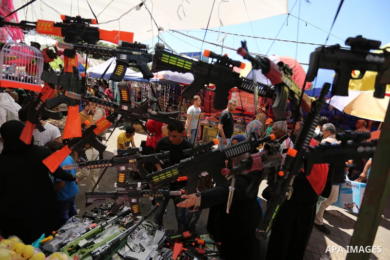 Palestinians shop at a market ahead of Eid al-Fitr holiday, in Gaza city on June 24, 2017. Eid al-Fitr marks the end of Muslim's holy fasting month of Ramadan when faithfuls abstain from eating, drinking, smoking and sex...