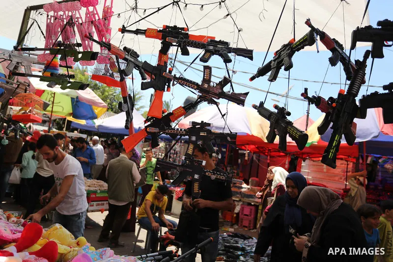 Palestinians shop at a market ahead of Eid al-Fitr holiday, in Gaza city on June 24, 2017. Eid al-Fitr marks the end of Muslim's holy fasting month of Ramadan when faithfuls abstain from eating, drinking, smoking and sex...