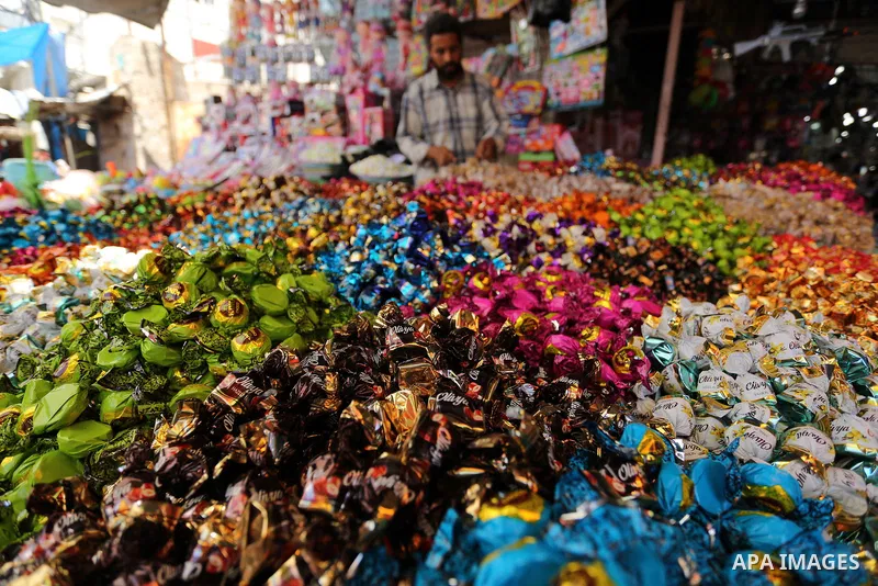 A Palestinian vendor sells chocolate at a market ahead of Eid al-Fitr holiday, in Gaza city on June 24, 2017. Eid al-Fitr marks the end of Muslim's holy fasting month of Ramadan when faithfuls abstain from eating, drinki...