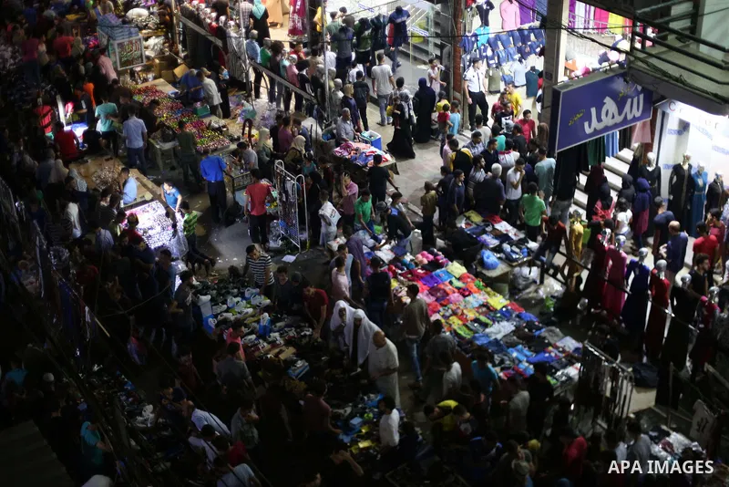 Palestinians shop at a market ahead of Eid al-Fitr holiday, in Gaza city on June 24, 2017. Eid al-Fitr marks the end of Muslim's holy fasting month of Ramadan when faithfuls abstain from eating, drinking, smoking and sex...
