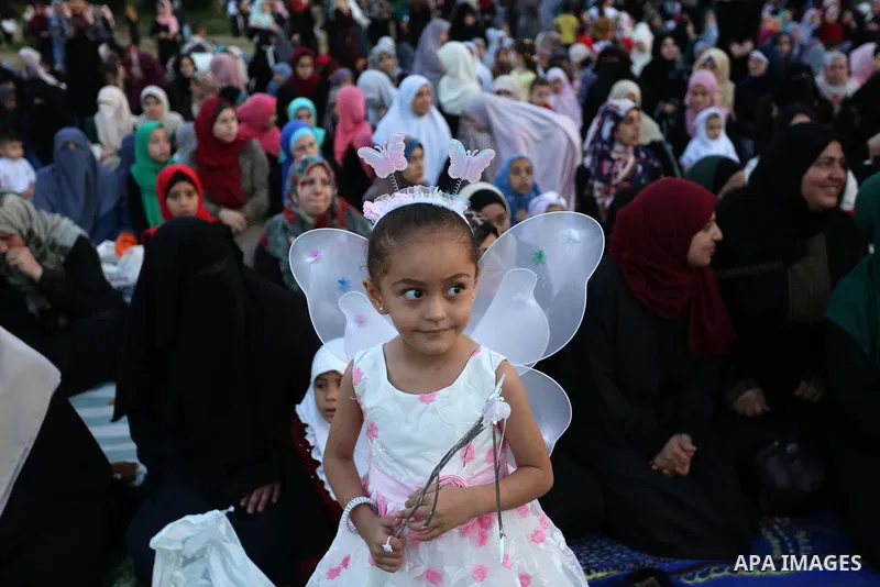 Palestinian Muslim women perform Eid al-Fitr prayers in Gaza City June 25, 2017. Eid al-Fitr marks the end of Muslim's holy fasting month of Ramadan when faithfuls abstain from eating, drinking, smoking and sexual activi...