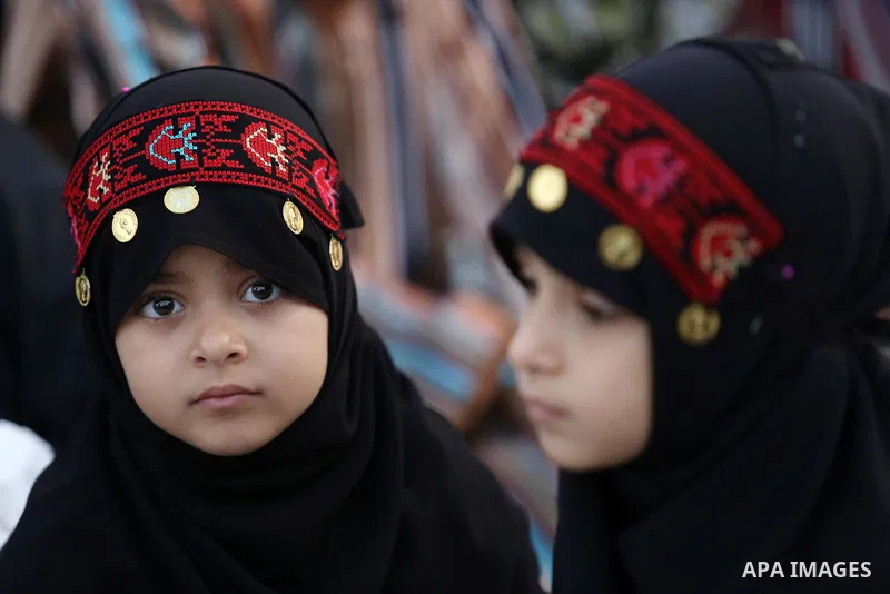 Palestinian Muslim girls attend Eid al-Fitr prayers in Gaza City June 25, 2017. Eid al-Fitr marks the end of Muslim's holy fasting month of Ramadan when faithfuls abstain from eating, drinking, smoking and sexual activit...