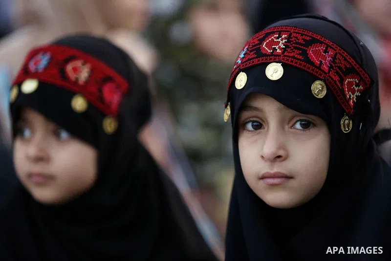 Palestinian Muslim girls attend Eid al-Fitr prayers in Gaza City June 25, 2017. Eid al-Fitr marks the end of Muslim's holy fasting month of Ramadan when faithfuls abstain from eating, drinking, smoking and sexual activit...