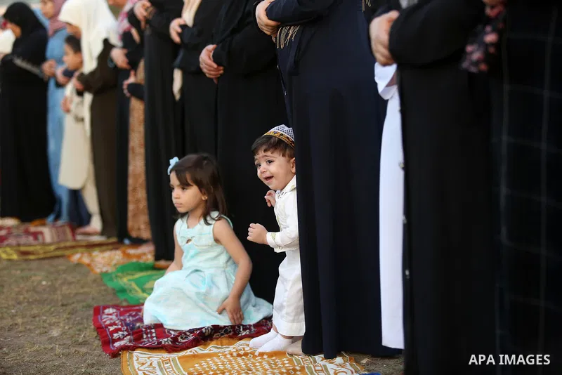 Palestinian Muslim women perform Eid al-Fitr prayers in Gaza City June 25, 2017. Eid al-Fitr marks the end of Muslim's holy fasting month of Ramadan when faithfuls abstain from eating, drinking, smoking and sexual activi...