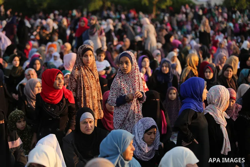 Palestinian Muslim women perform Eid al-Fitr prayers in Gaza City June 25, 2017. Eid al-Fitr marks the end of Muslim's holy fasting month of Ramadan when faithfuls abstain from eating, drinking, smoking and sexual activi...